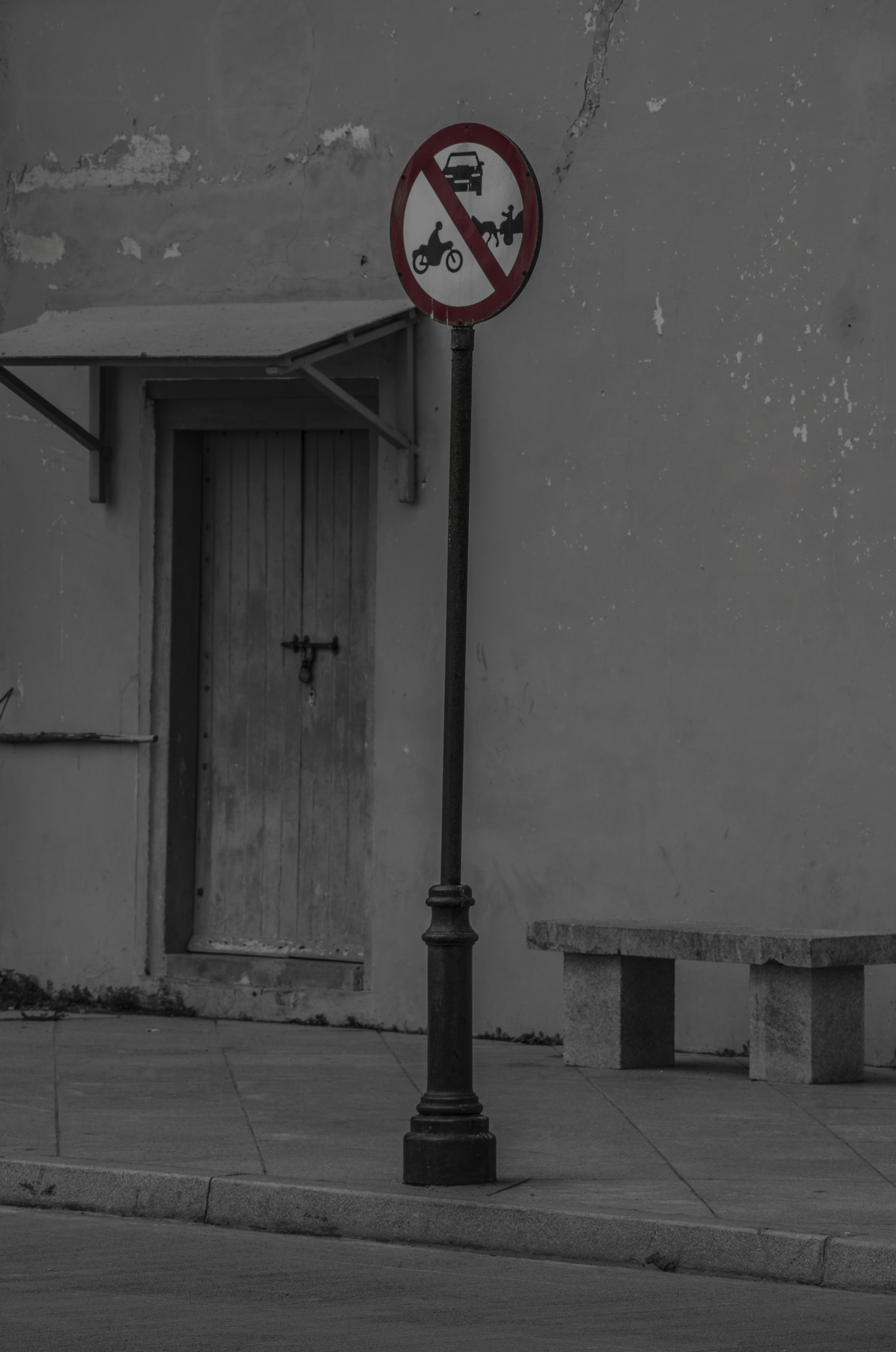 a no parking sign on a street corner